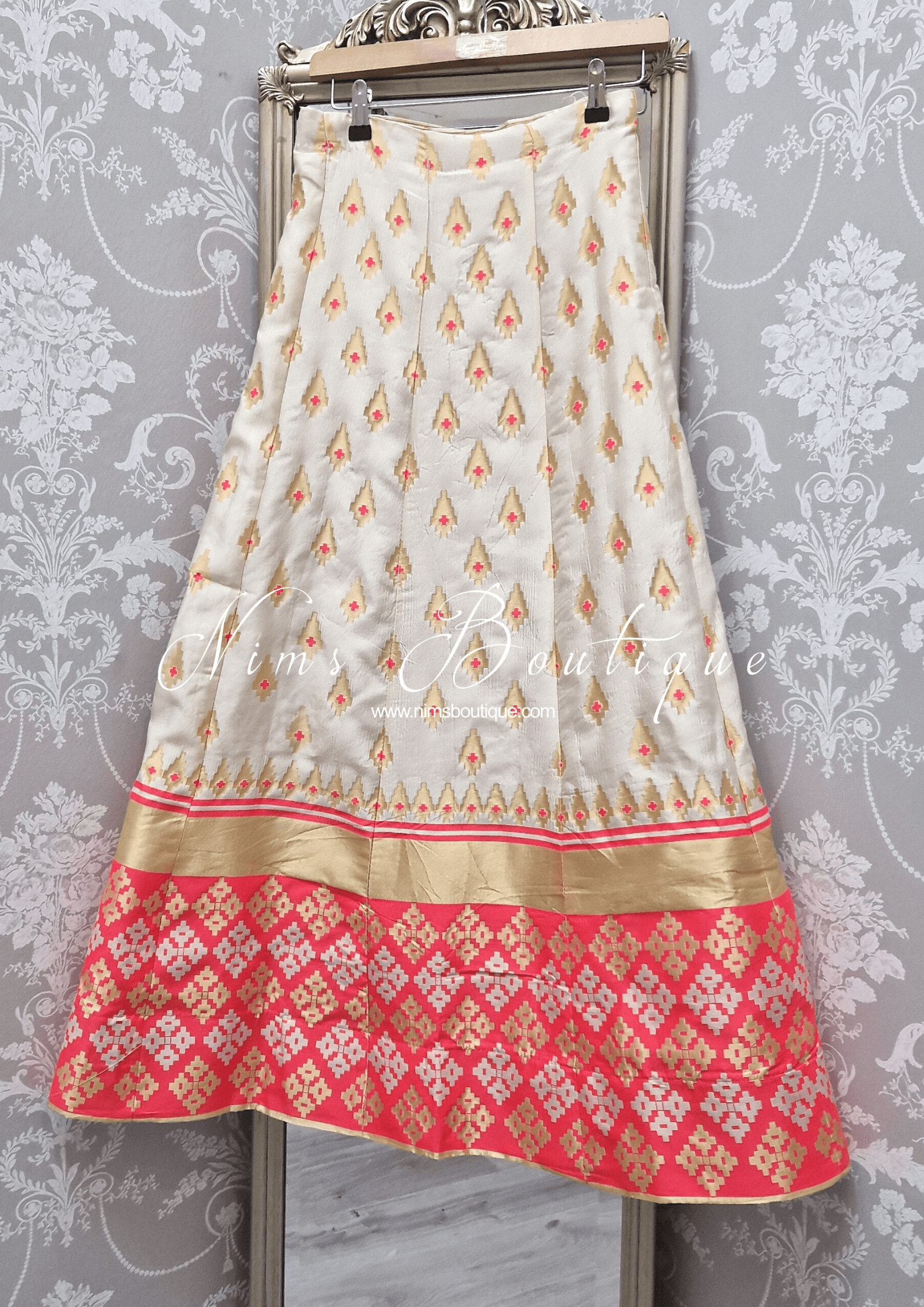 Nims Boutique Ivory & Coral Brocade Semi stitched skirt/lehnga