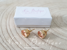 The NB Gold stud earrings