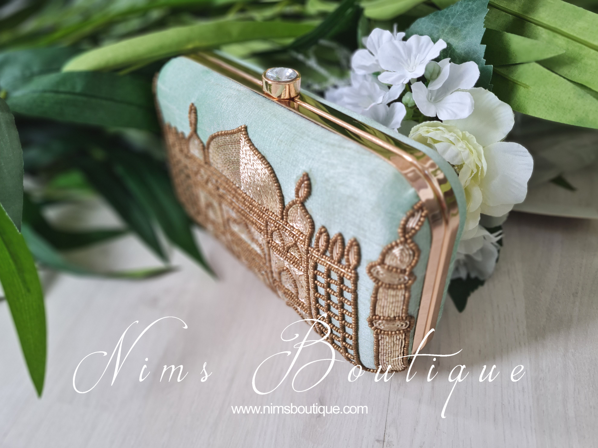 Rose gold store designer clutch
