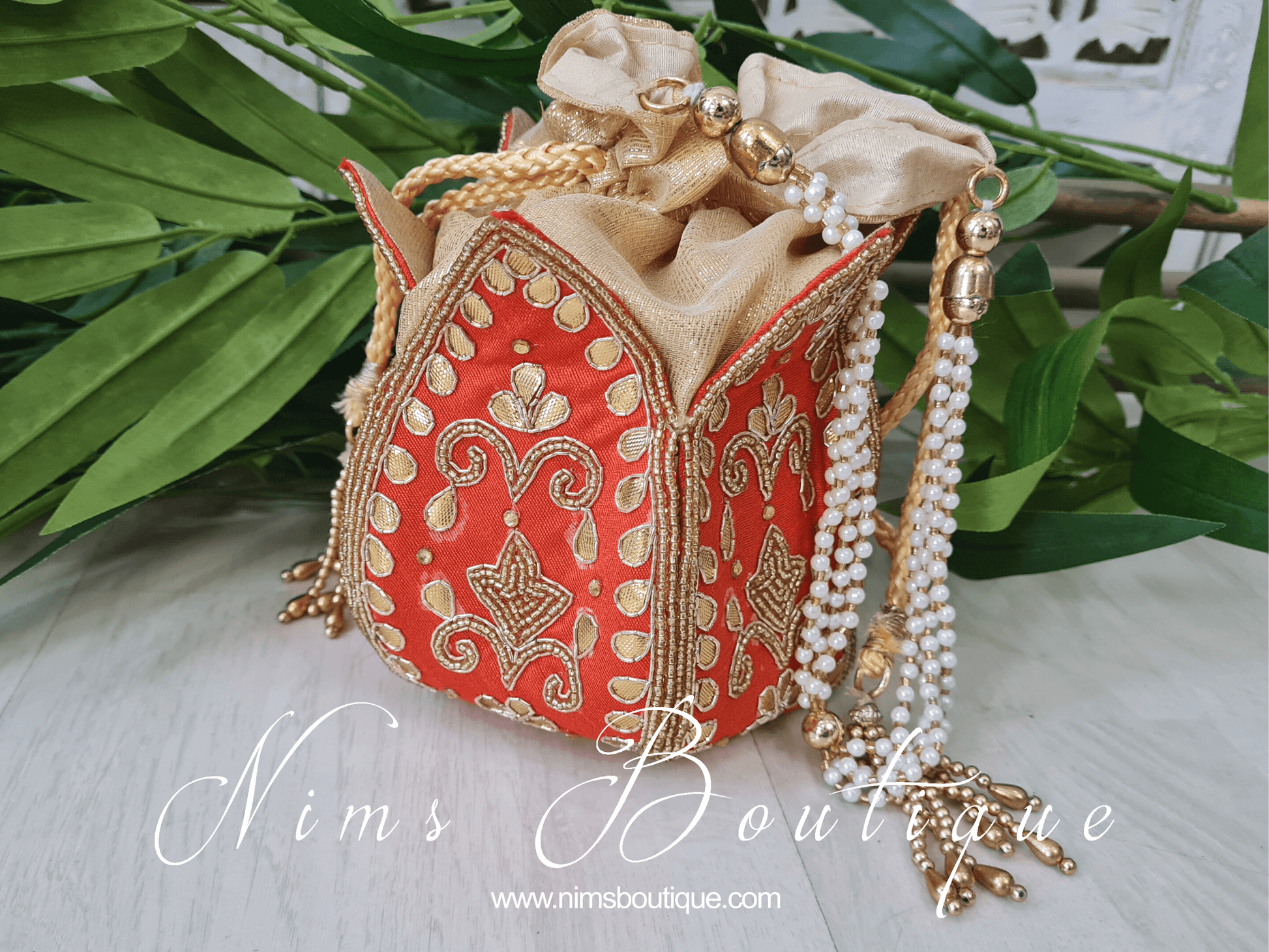 Nims Boutique Deep Orange Potli Raw Silk Embellished Bag