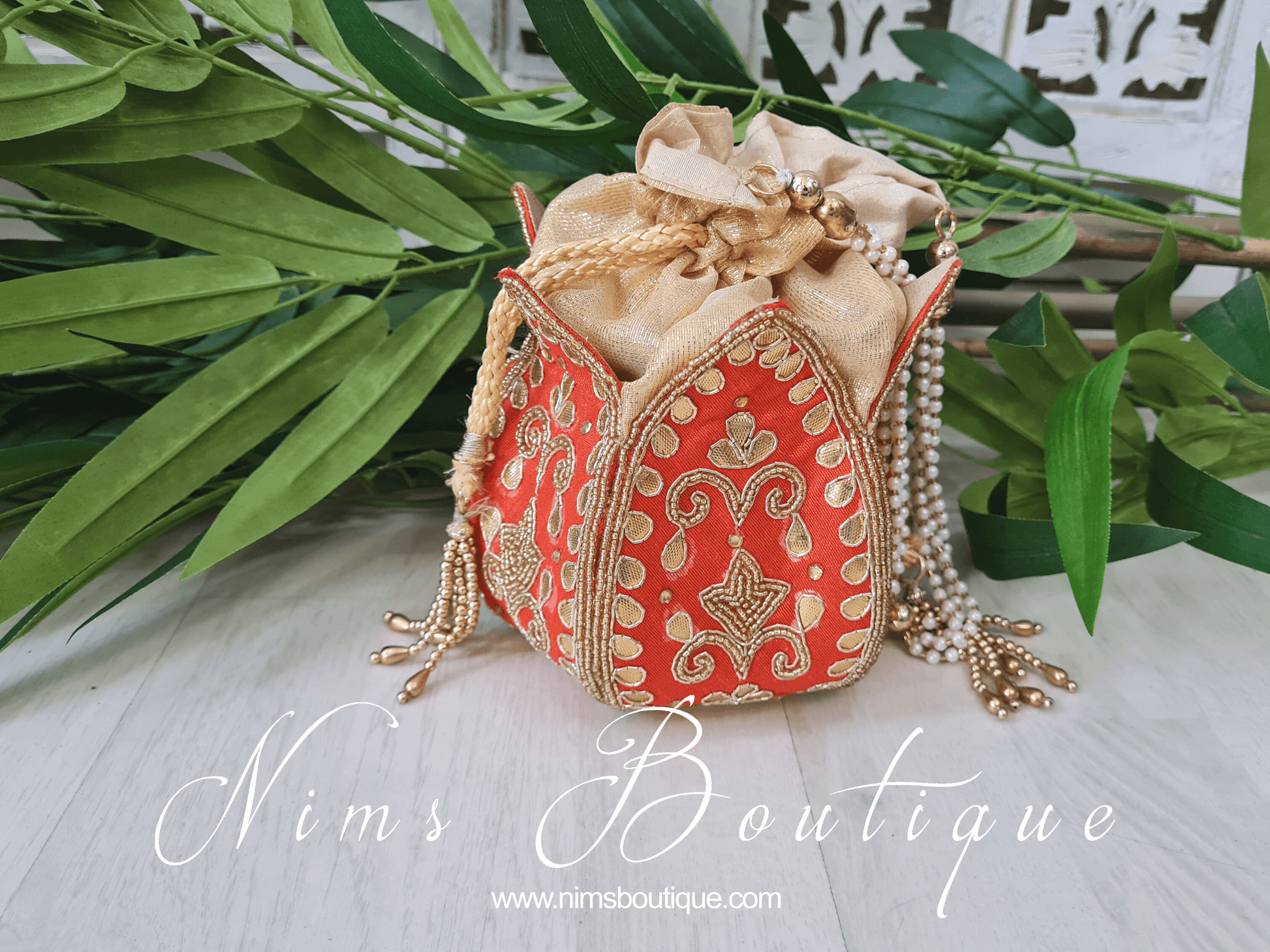Nims Boutique Deep Orange Potli Raw Silk Embellished Bag