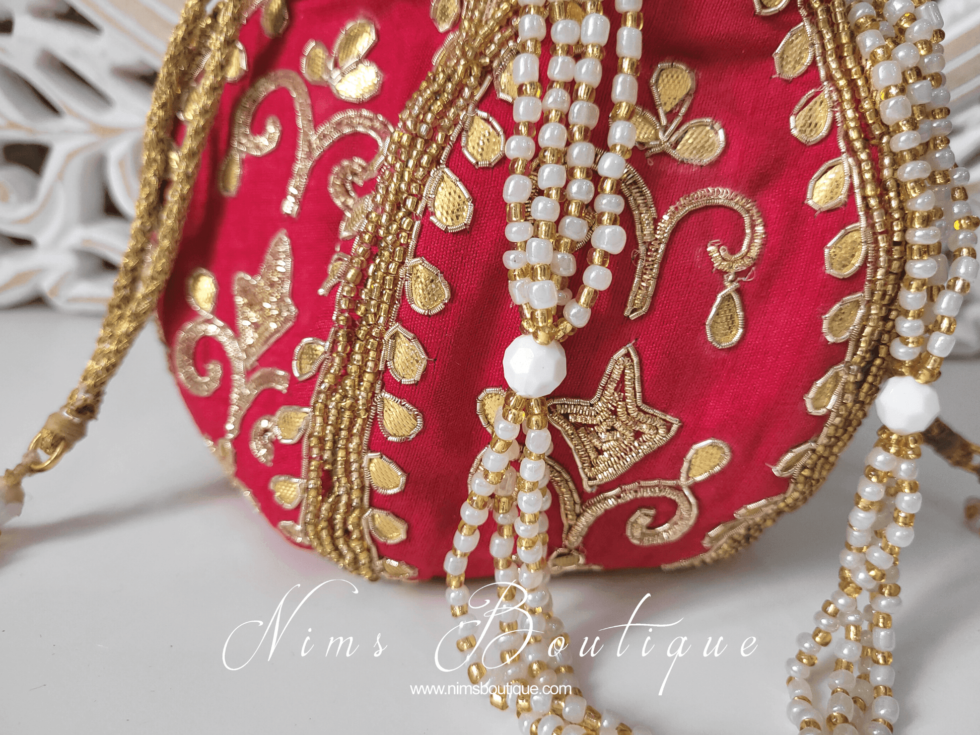 Nims Boutique Bright Red Potli Raw Silk Embellished Bag